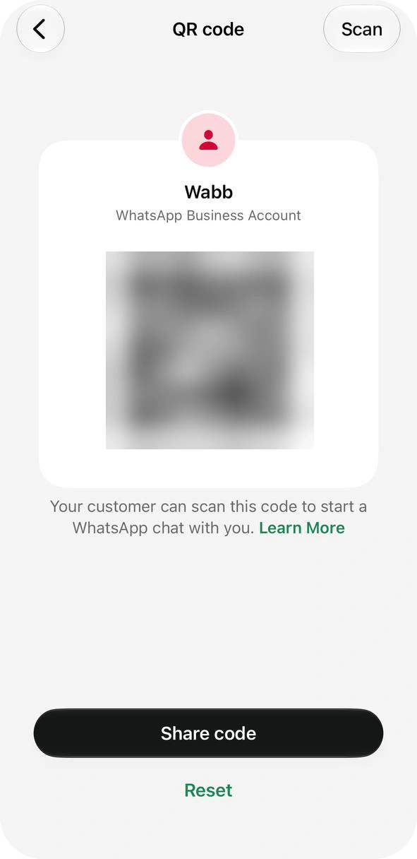 WhatsApp Business QR code screen with a blurred code, Share code and Reset buttons