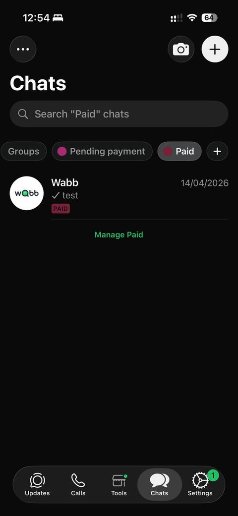 WhatsApp Business Chats screen showing Groups, Pending payment, and Paid filters at the top, with a conversation tagged Paid