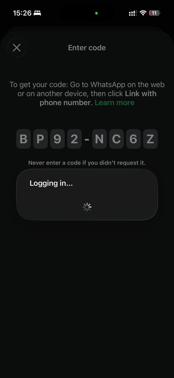 WhatsApp Enter code screen on the phone with the code typed in and Logging in shown
